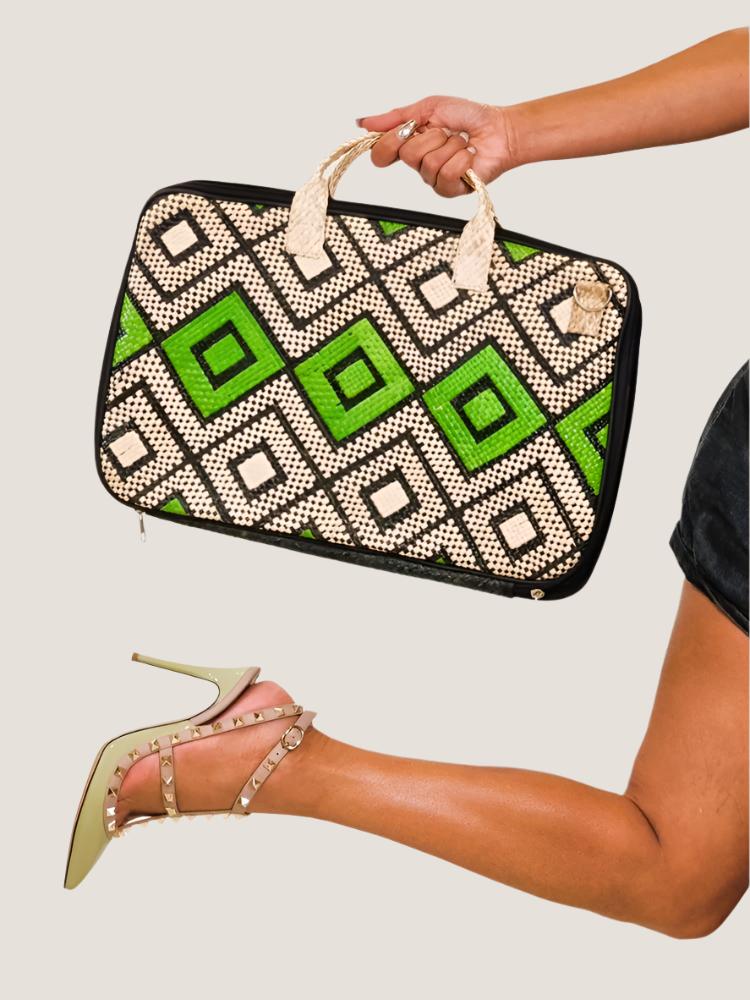 A person holding the Tala Woven Laptop Bag outdoors, highlighting the stylish and durable design crafted by Filipino artisans.